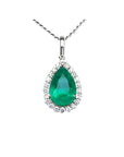 18K white gold pear-shaped emerald pendant with a halo of natural diamonds on a delicate chain.