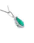 18K white gold pear-shaped emerald pendant with a halo of natural diamonds on a chain.
