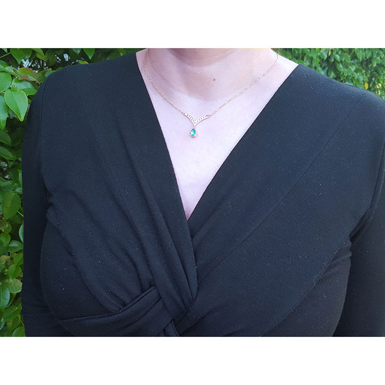 May's birthstone tear drop emerald necklace: this natural Muzo Colombian gem is dangling from a chevron design in 14k yellow gold