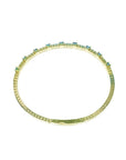 Flexible 14K yellow gold bangle bracelet with square-cut emeralds and accent diamonds.