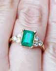 An emerald ring for ladies on a finger