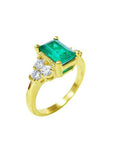 14K yellow gold ring with a rectangular emerald and three accent diamonds on each side.