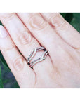 14K white gold diamond ring guard enhancer wrapper with double row natural diamonds, worn on a hand.