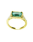 1.30 carat emerald-cut natural Colombian emerald ring in 14K yellow gold, east-west style with diamond accents.