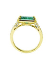 1.30 carat emerald-cut natural Colombian emerald ring in 14K yellow gold, east-west style with diamond accents.
