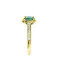 1.30 carat emerald-cut natural Colombian emerald ring in 14K yellow gold, east-west style with diamond accents.