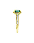 1.30 carat emerald-cut natural Colombian emerald ring in 14K yellow gold, east-west style with diamond accents.
