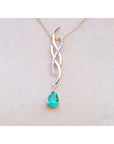 Colombian emerald necklace a 1.00 carat dangling pear cut emerald 14k yellow gold intertwined diamond design