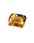 Loose yellow sapphire emerald cut from Sri Lanka, front left side position displaying table and crown