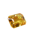 Loose yellow sapphire emerald cut from Sri Lanka, front right side position displaying table and crown