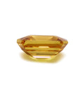 Loose yellow sapphire emerald cut from Sri Lanka, underside view displaying girdle and pavilion