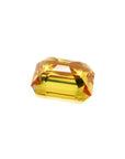 Loose yellow sapphire emerald cut from Sri Lanka, upside down displaying pavilion