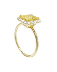 14K yellow gold ring with emerald-cut natural yellow sapphire and diamond halo.