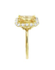 14K yellow gold ring with emerald-cut natural yellow sapphire and diamond halo.
