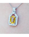 Natural yellow sapphire pendant necklace halo diamond crafted in 18k white gold, offering a refined and sophisticated accessory for women.