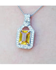 Natural yellow sapphire pendant necklace halo diamond crafted in 18k white gold, offering a refined and sophisticated accessory for women.