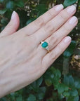 Emerald Ring with Trillion Side Diamonds 18k Gold