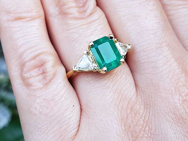 Emerald Ring with Trillion Side Diamonds 18k Gold