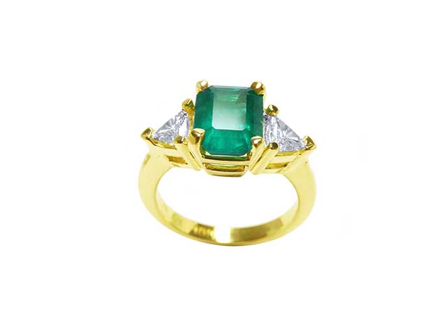 Emerald ring with hot sale trillion side diamonds