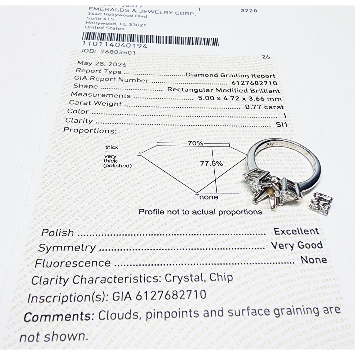 Diamond grading report with a ring illustration on a white background