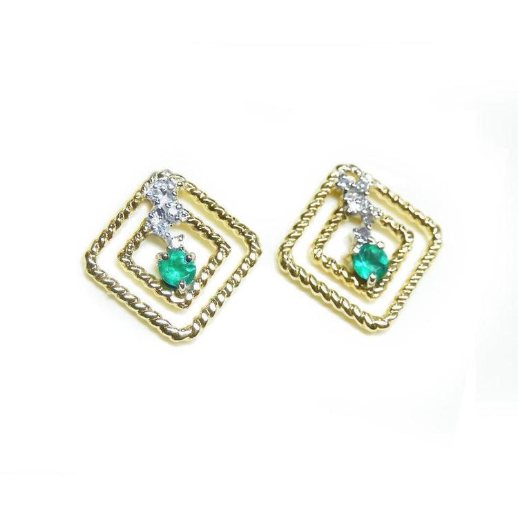 A pair of 14K yellow gold emerald post earrings with round cut Colombian emeralds set in a double frame rope decoration.
