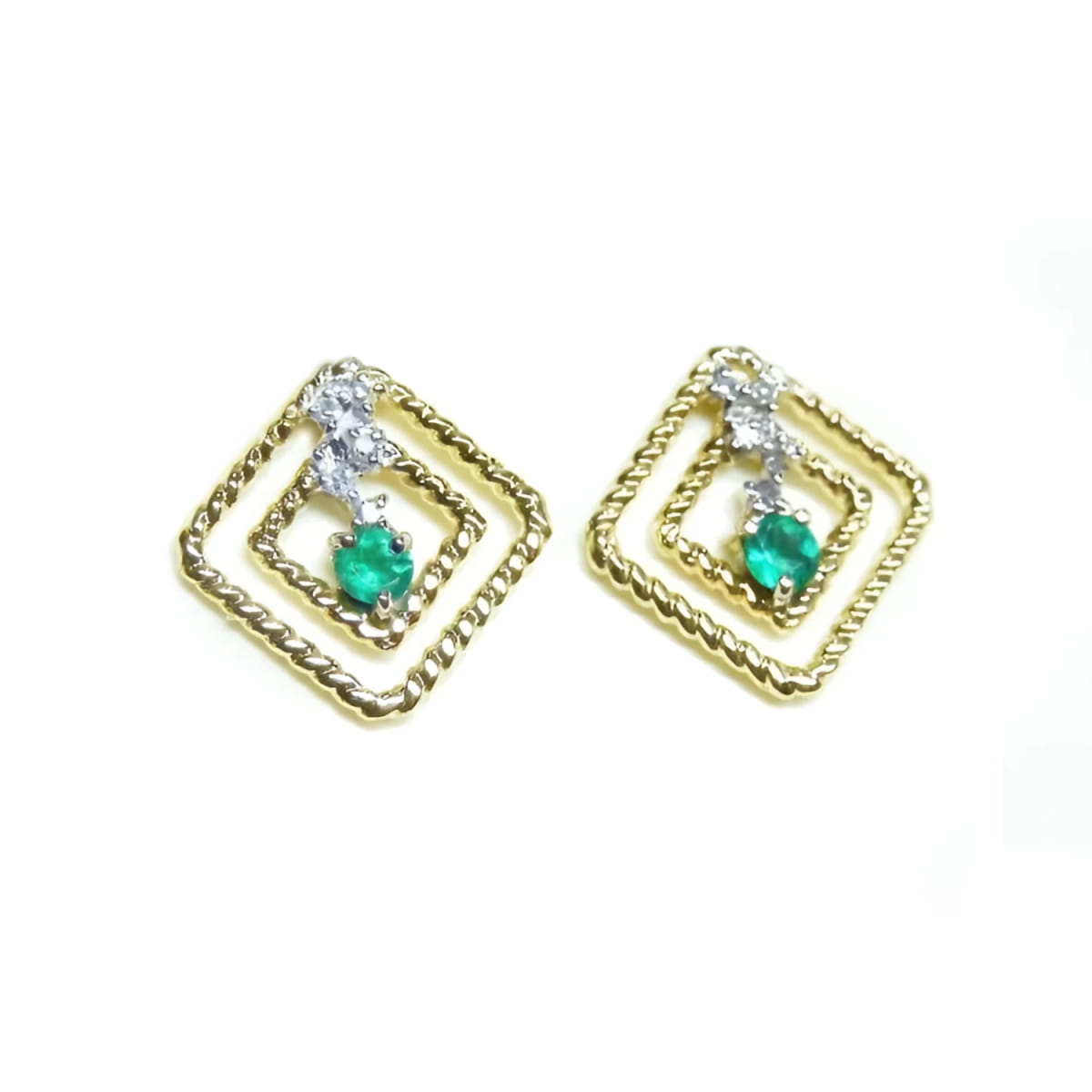 A pair of 14K yellow gold emerald post earrings with round cut Colombian emeralds set in a double frame rope decoration.
