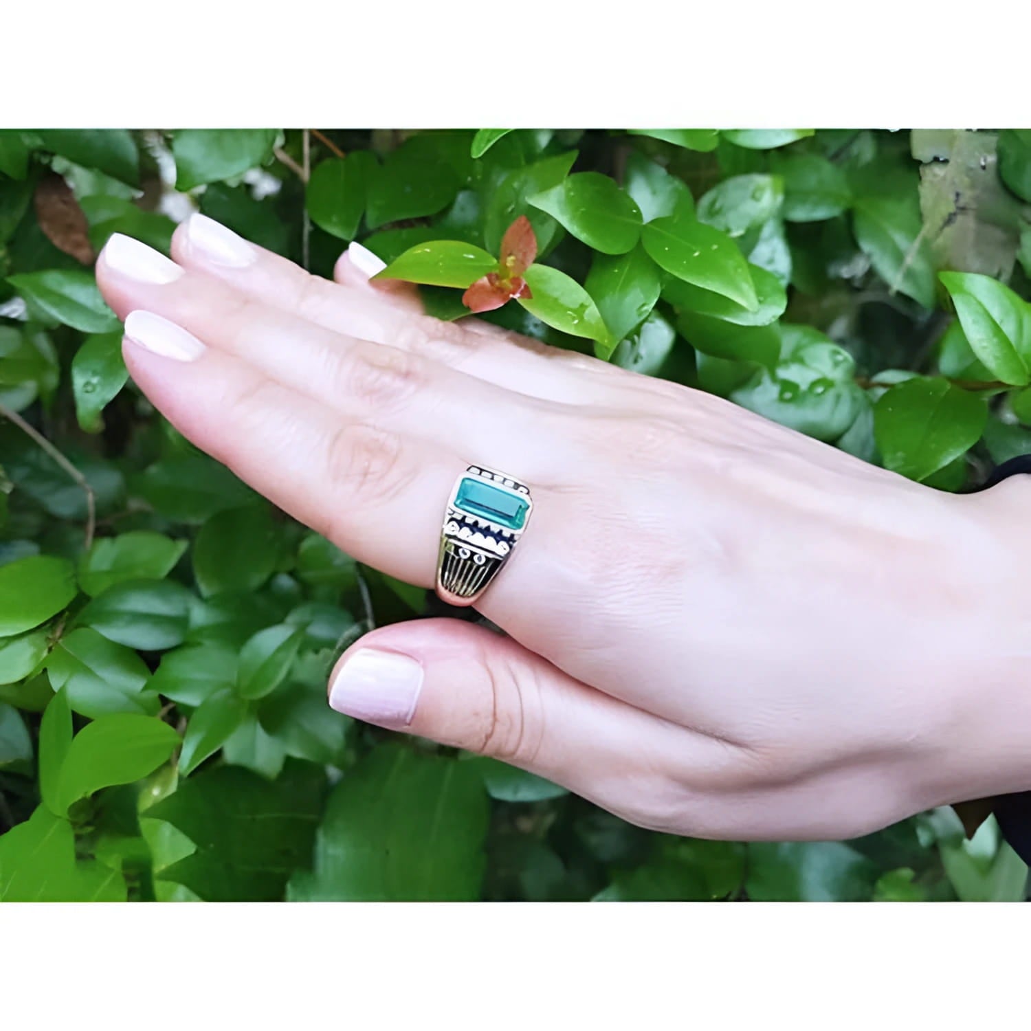 Men's 14K yellow gold ring with a bezel-set Colombian emerald and burnish-set diamonds.