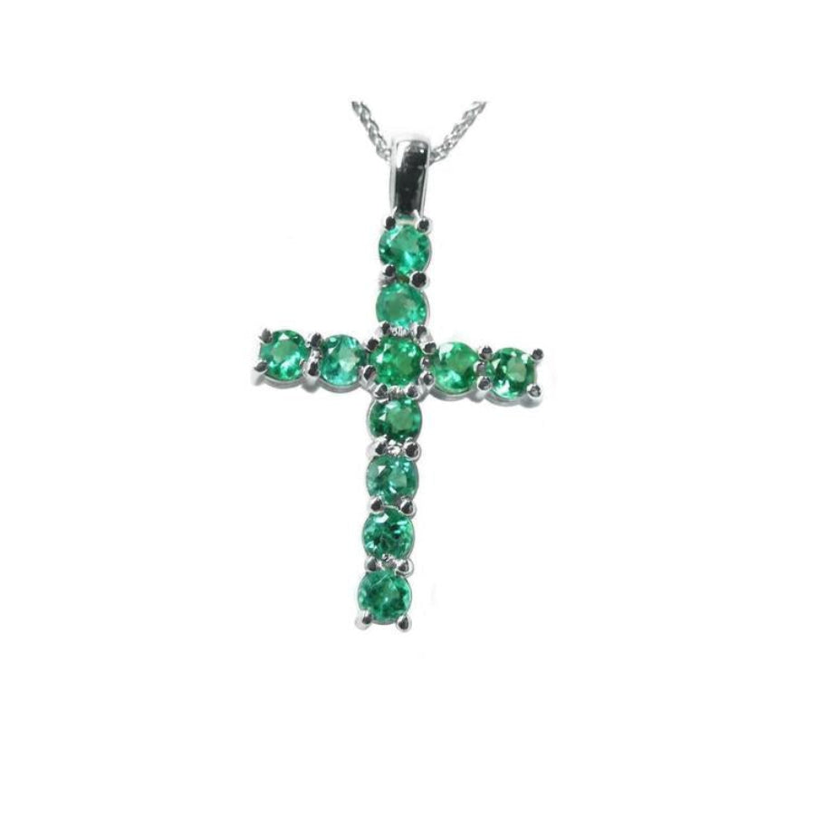 18K white gold cross pendant with eleven round-cut natural Colombian emeralds.