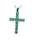 18K white gold cross pendant with eleven round-cut natural Colombian emeralds.