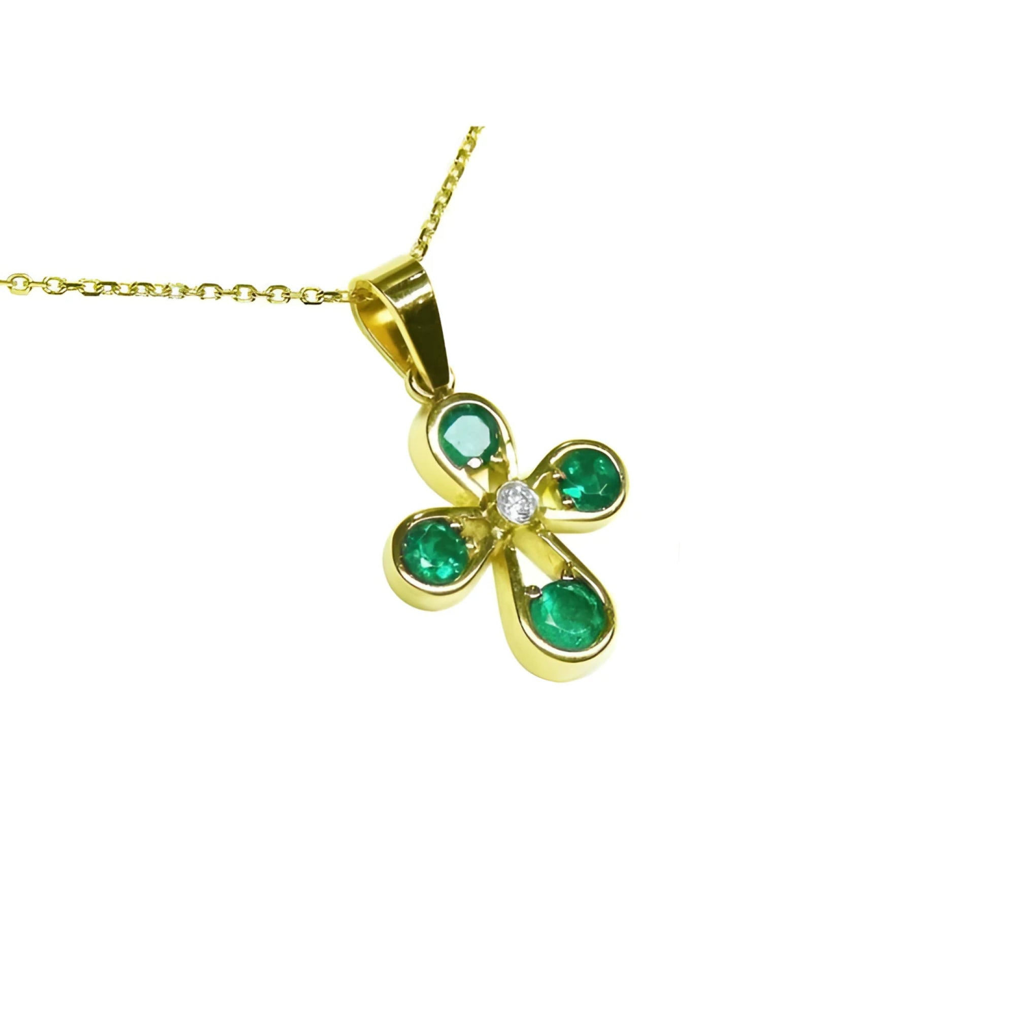 Gold necklace with a crossr-shaped pendant featuring natural emeralds on a right-side top position view.