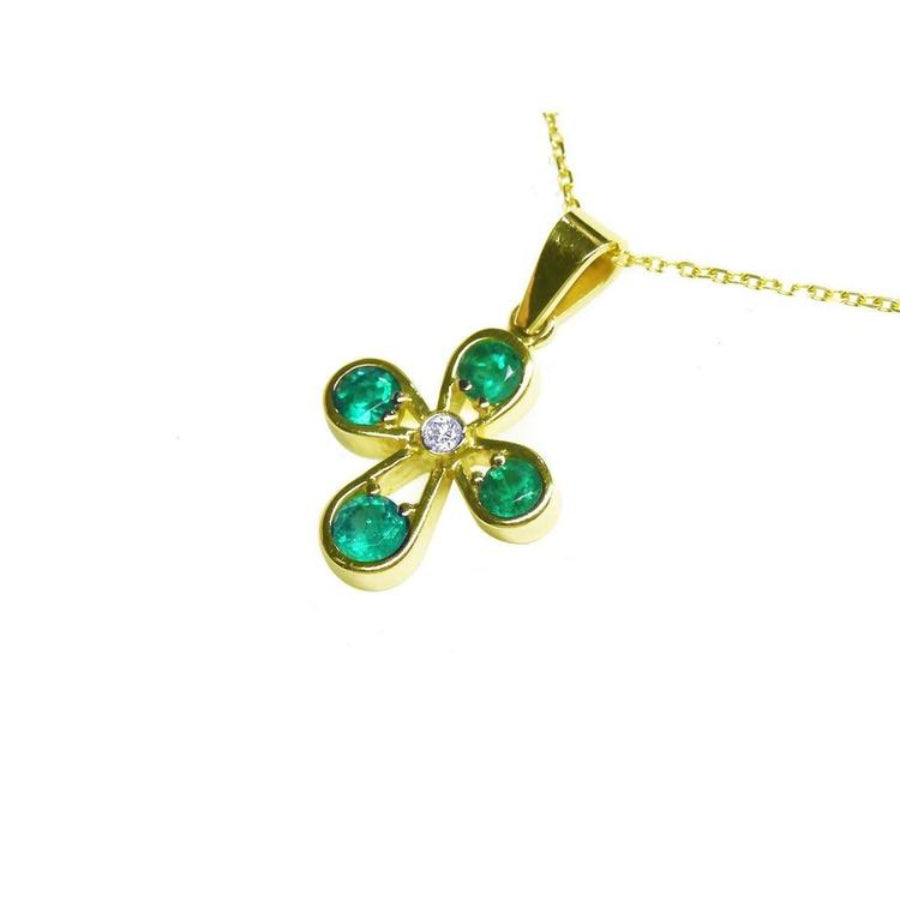 Yellow gold flower gold pendant with four round emeralds and a center diamond on a delicate chain.