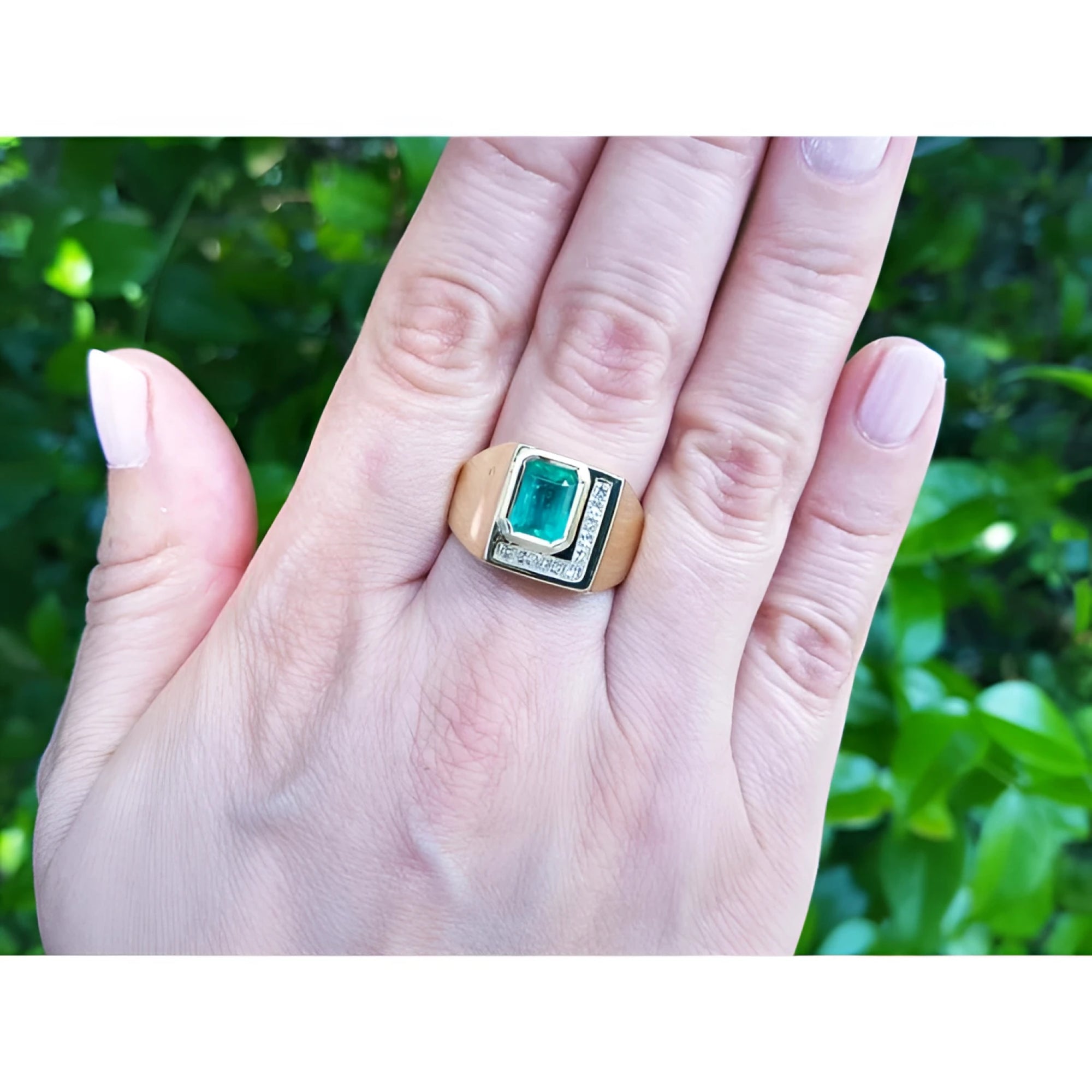 Men's 18K yellow gold ring with a rectangular emerald and channel-set princess-cut diamonds.