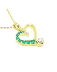18k yellow gold heart-shaped pendant with natural round cut colombian emeralds and diamond.