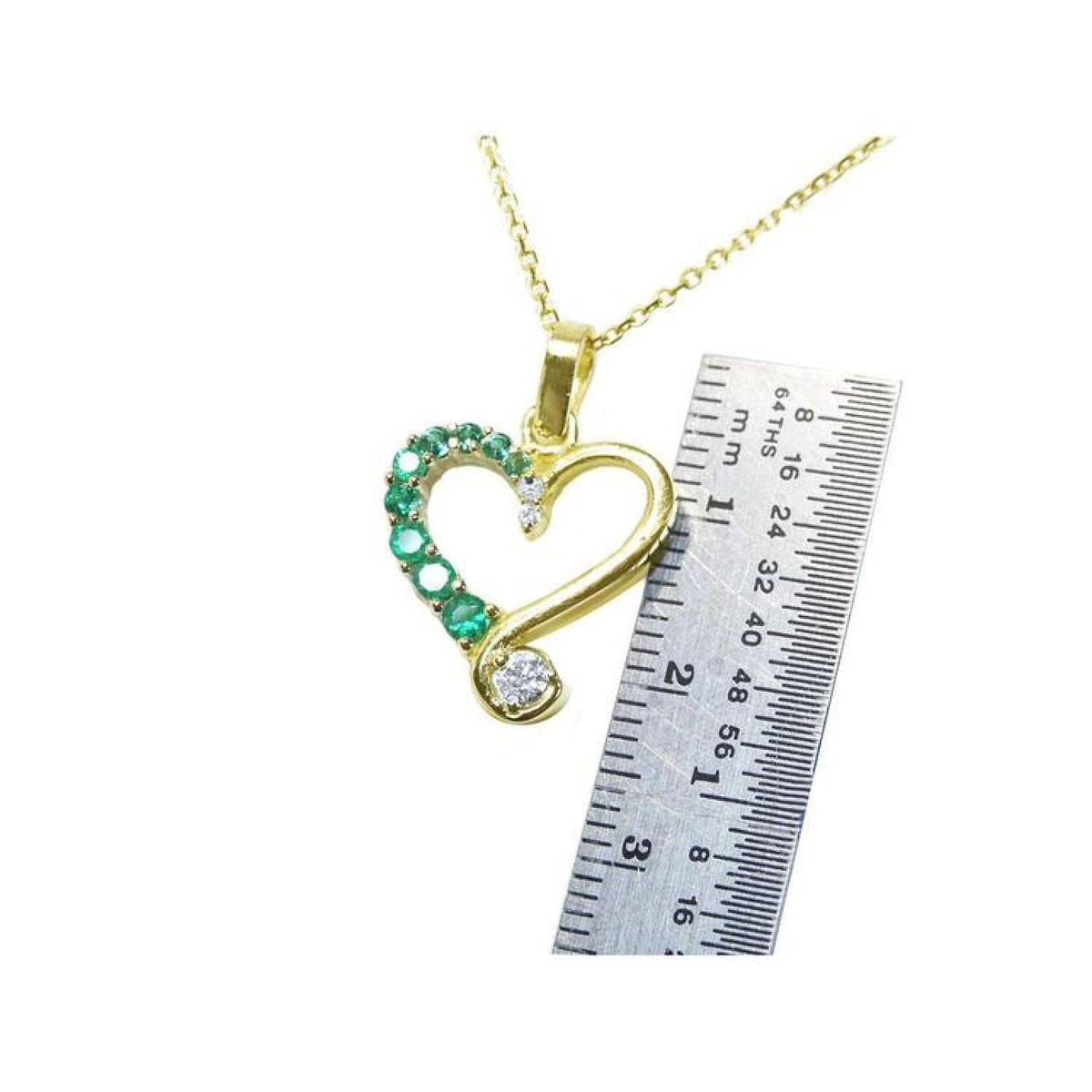 18K yellow gold heart pendant with natural emeralds and diamonds, shown with a ruler for size.