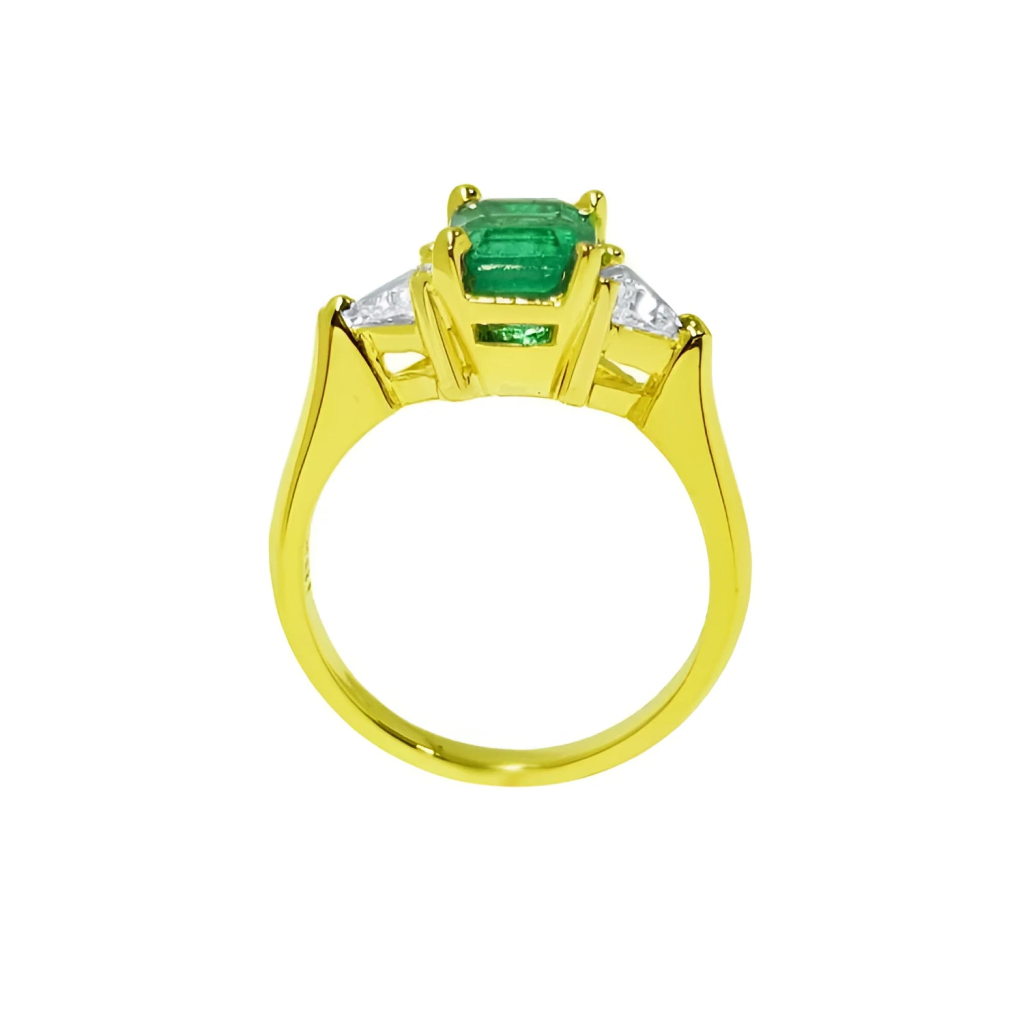 1.27 ct natural Colombian emerald three-stone ring in 18K yellow gold with trillion diamonds.