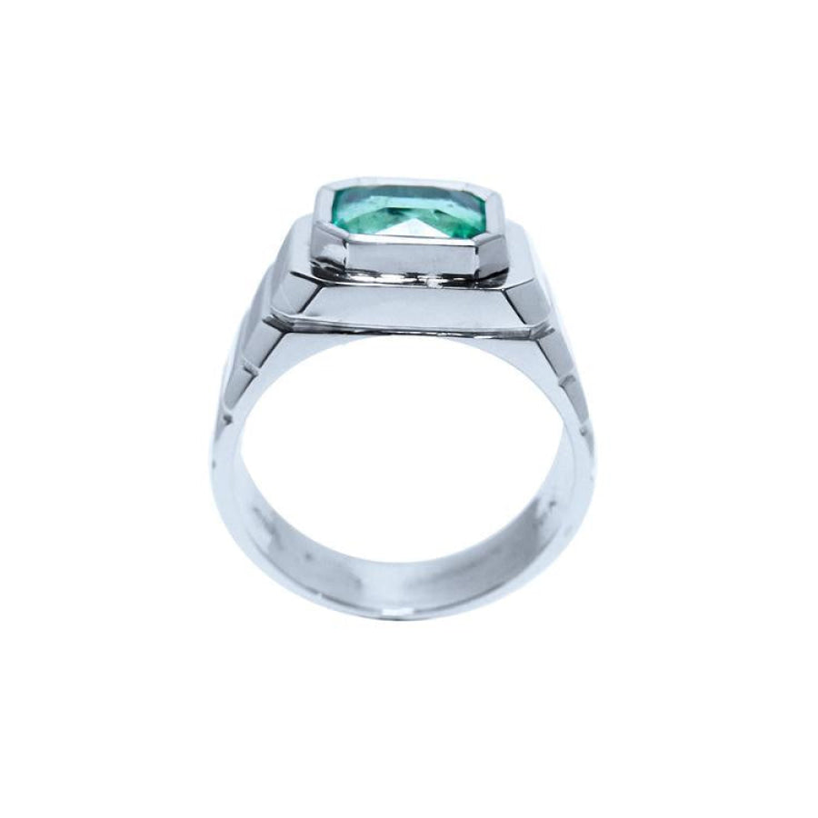 Men's 18K white gold ring with a bezel-set, modified emerald-cut deep bluish-green Muzo Colombian emerald.