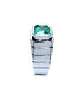 Side profile top bezel setting and band design of this white gold emerald ring for men are displayed.