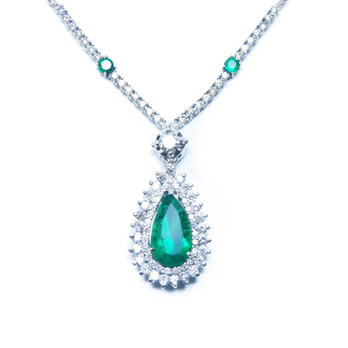 Emerald jewelry; this necklace features a 2.35 ct. pear-shaped Muzo emerald with a rich, deep green hue, set in 18K white gold