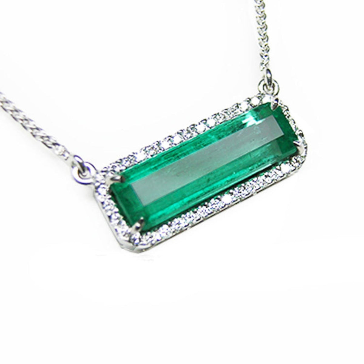 Emerald necklace elongated natural Colombian emerald 3.48 carats east west orientation crafted in 18k white gold