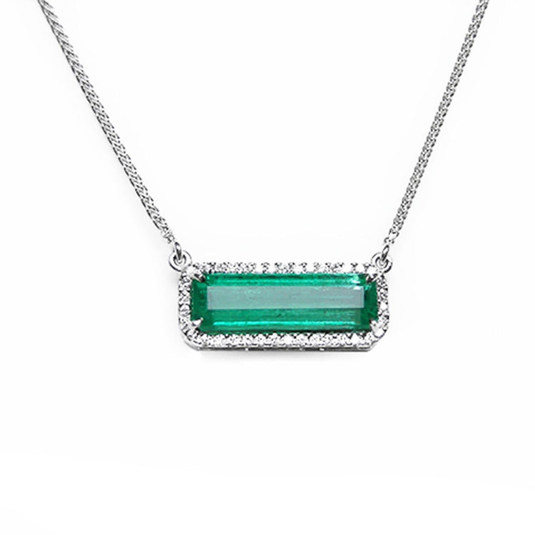 Emerald jewelry necklace elongated natural Colombian emerald 3.48 carats east west orientation encircle by halo diamonds