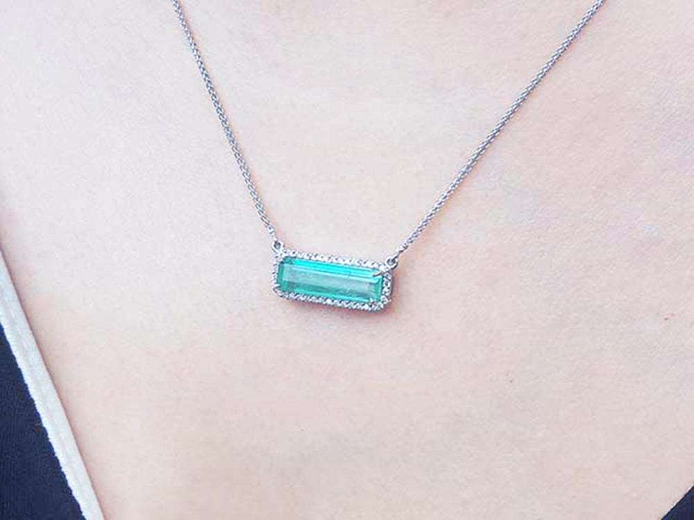 Genuine Emerald necklace 3.48 carats east west orientation encircle by halo diamonds crafted in 18k white gold
