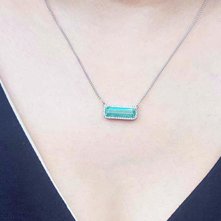 Real Emerald necklace elongated natural Colombian emerald 3.48 carats east west orientation encircle by halo diamonds