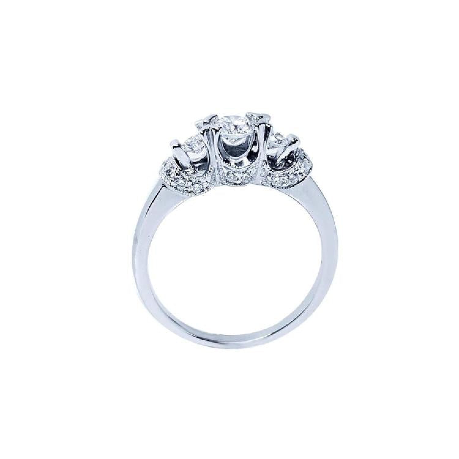 Round cut three stone diamond engagement ring in 14K white gold with pave set accent diamonds.