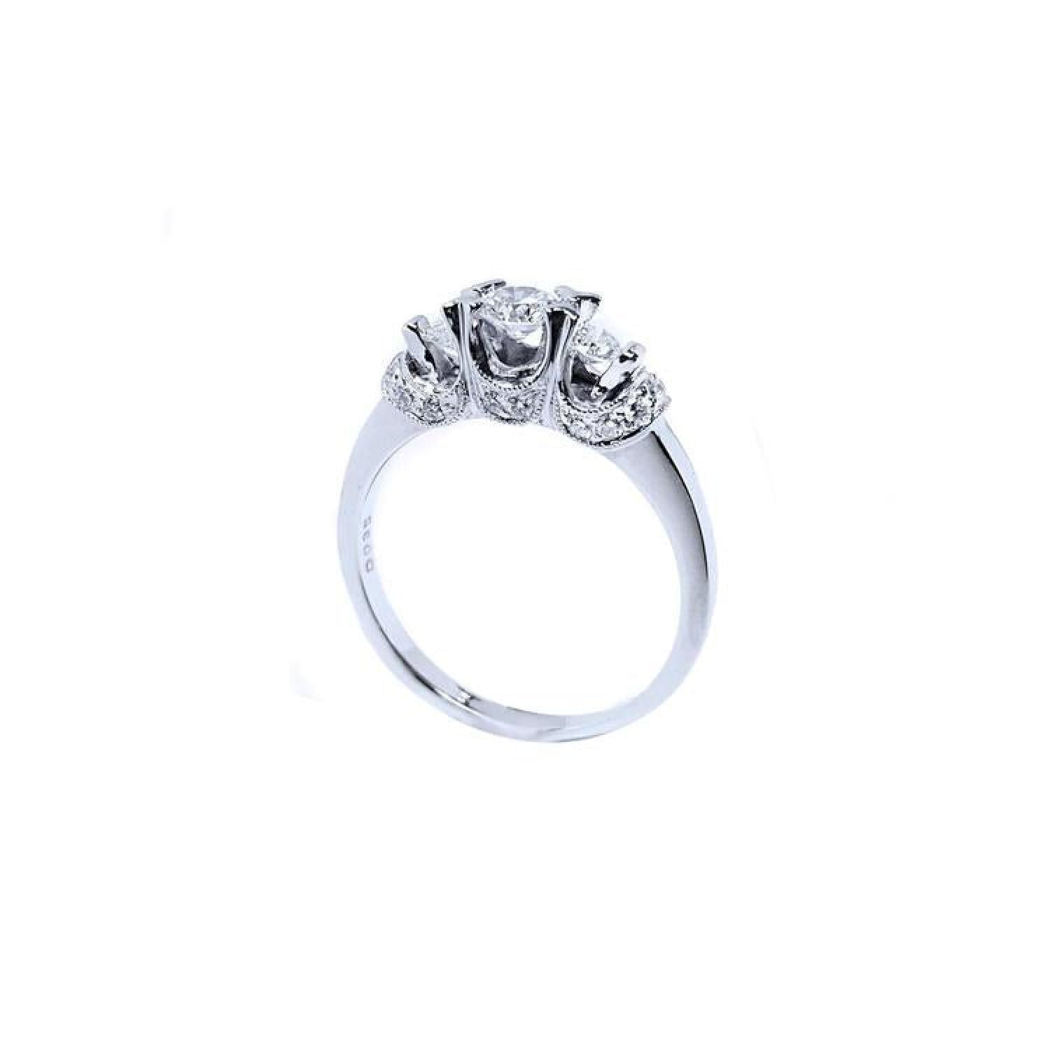 14K white gold three-stone engagement ring with round cut diamonds and pave set accents.