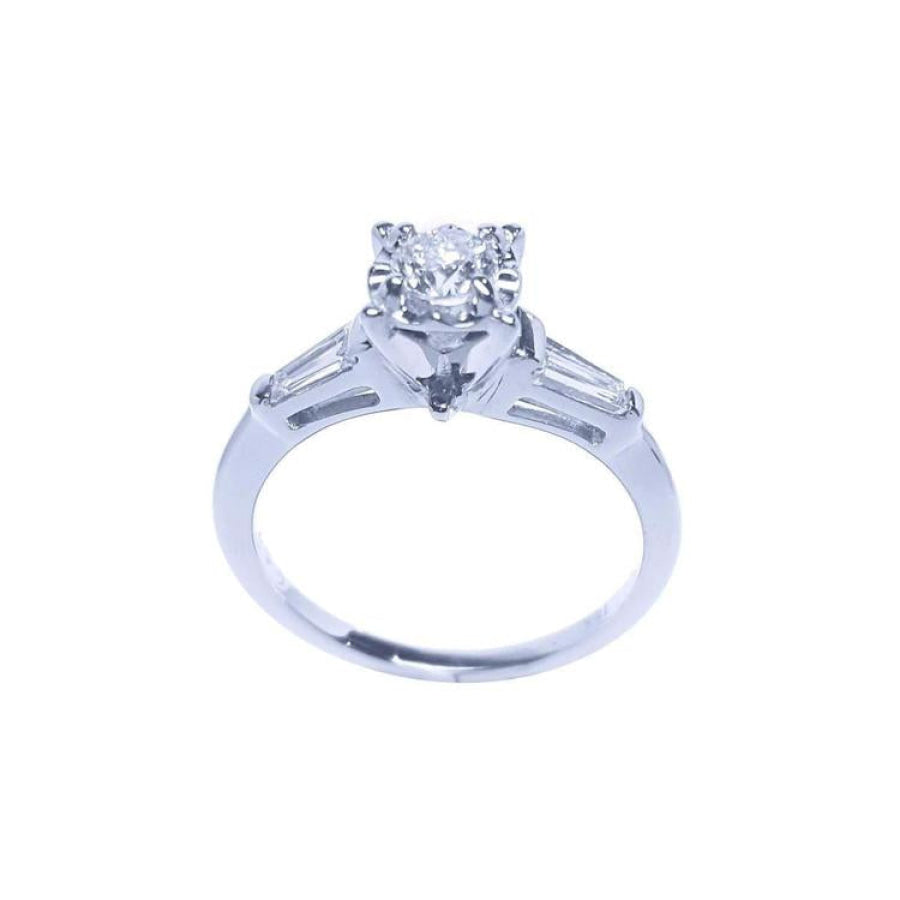 14k white gold engagement ring with a round central diamond and two baguette side diamonds.
