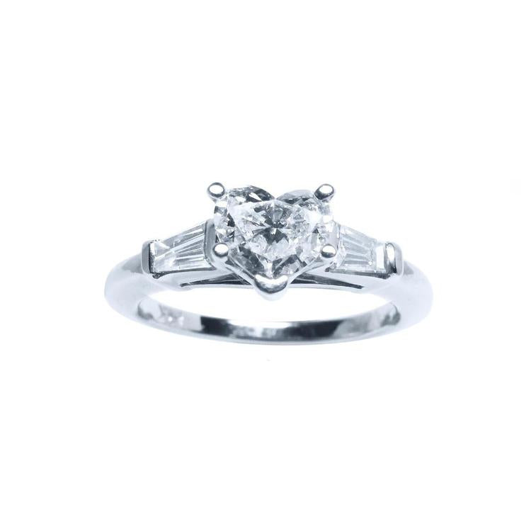 14K white gold heart-cut diamond engagement ring with side baguette diamonds.