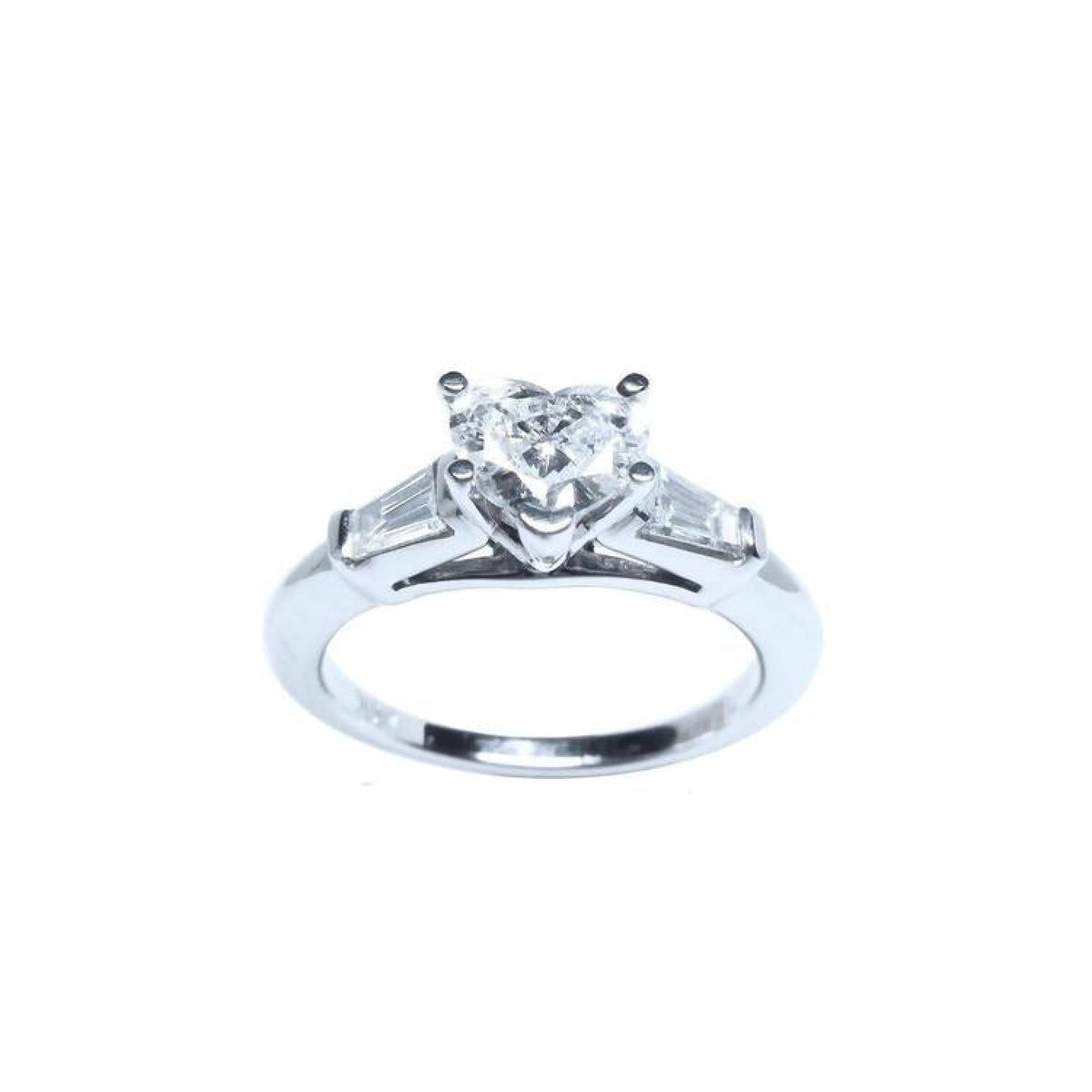 14K white gold ring with a heart-cut diamond center stone and two side baguette diamonds.