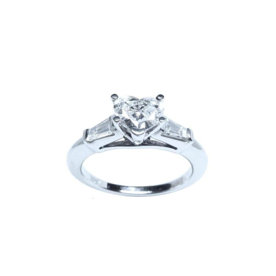 14K white gold ring with a heart-cut diamond center stone and two side baguette diamonds.