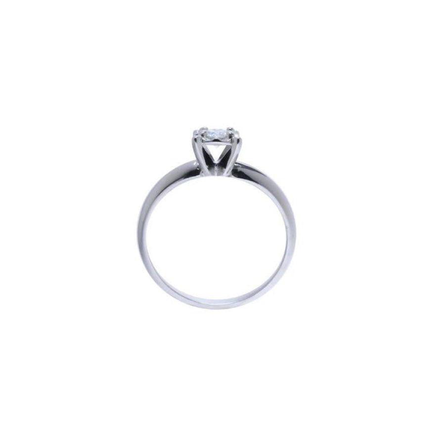 Round cut diamond solitaire engagement ring in 14K white gold with an illusion setting.