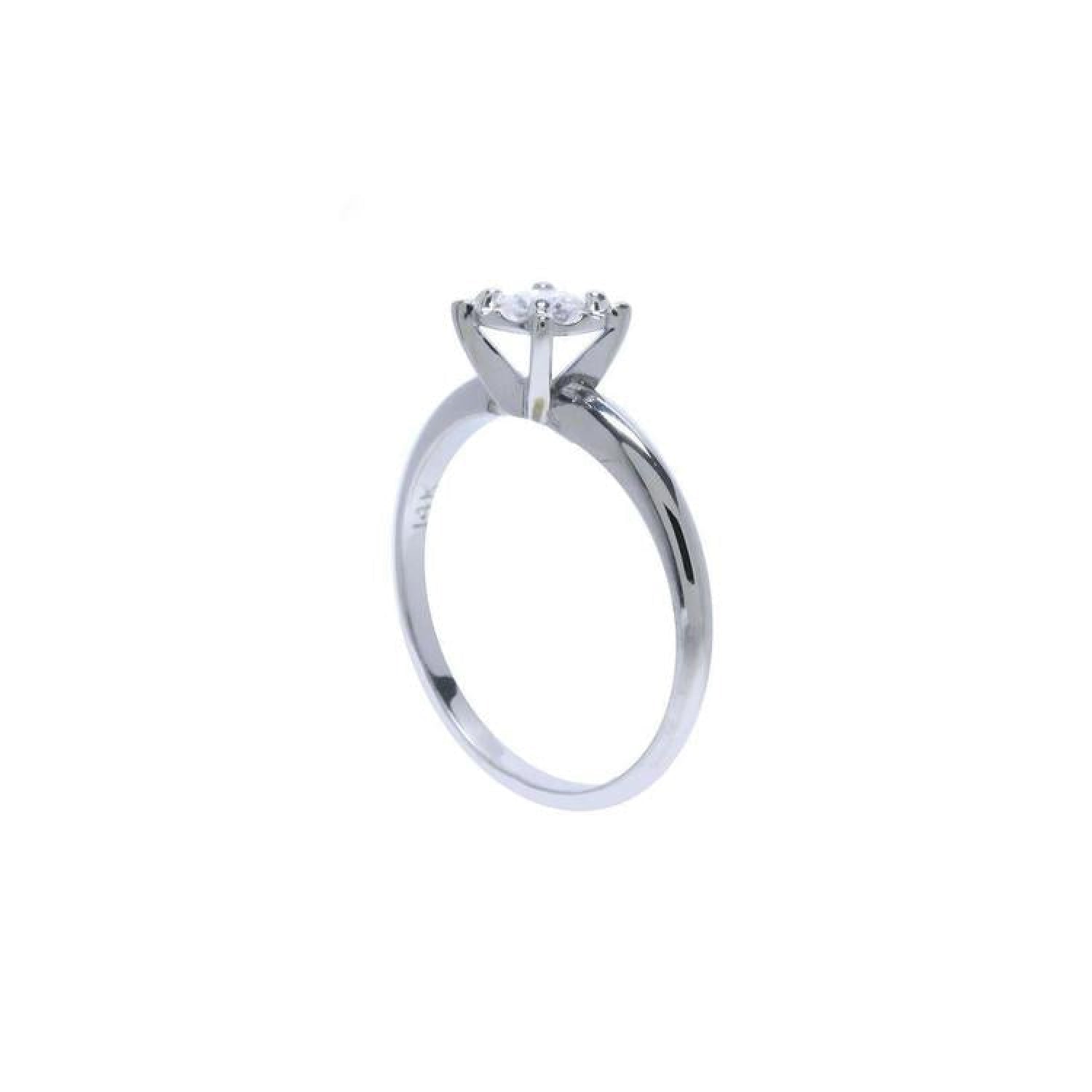 Round cut diamond solitaire engagement ring in 14K white gold with an illusion setting.
